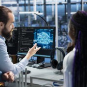 Data center programmers collaborating, working on neural networks AI databases